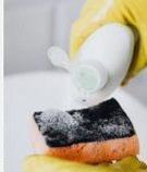 Scrubbing a surface with spray and sponge